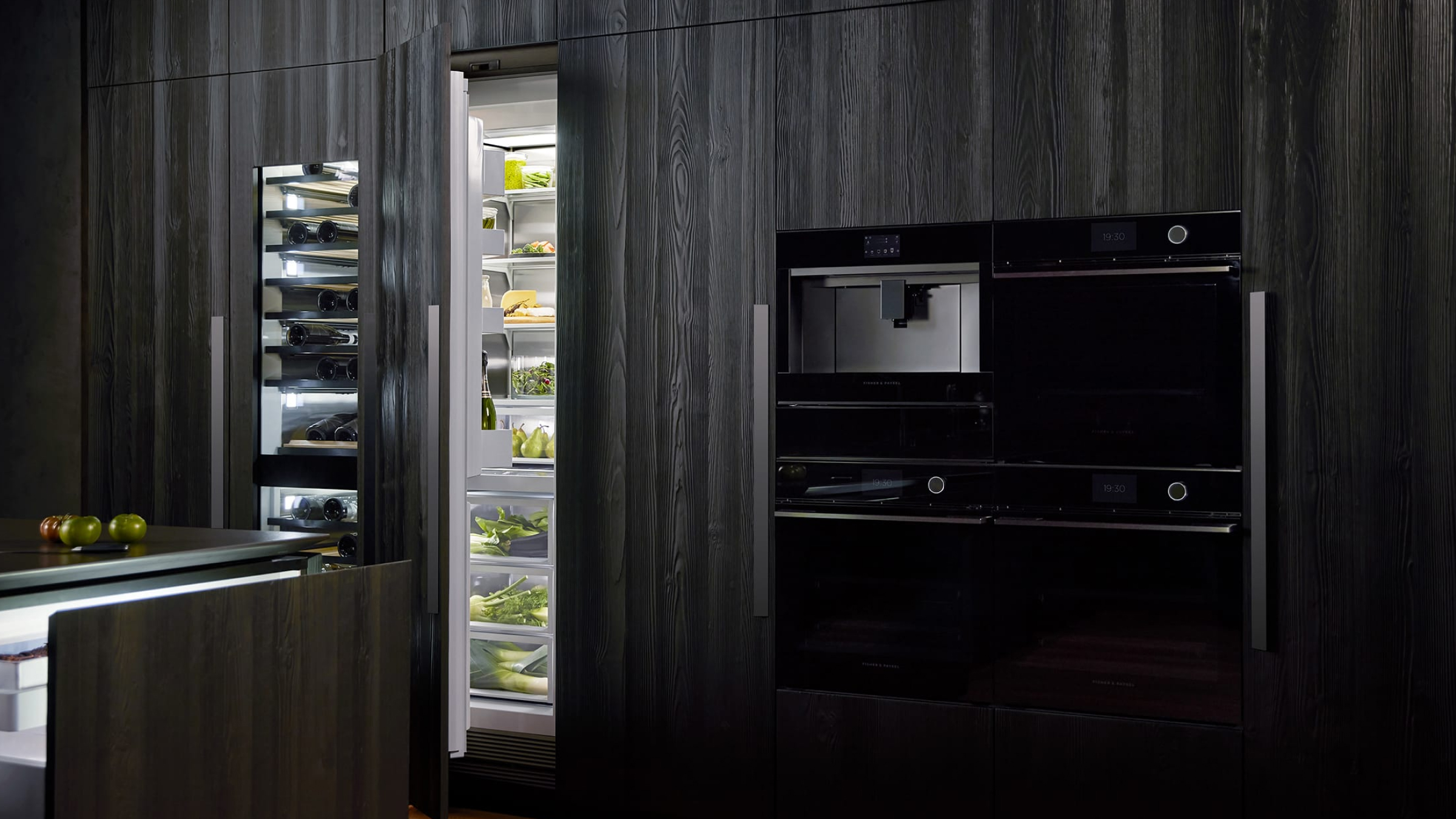 Black kitchen showing a range of Fisher & Paykel appliances insitu